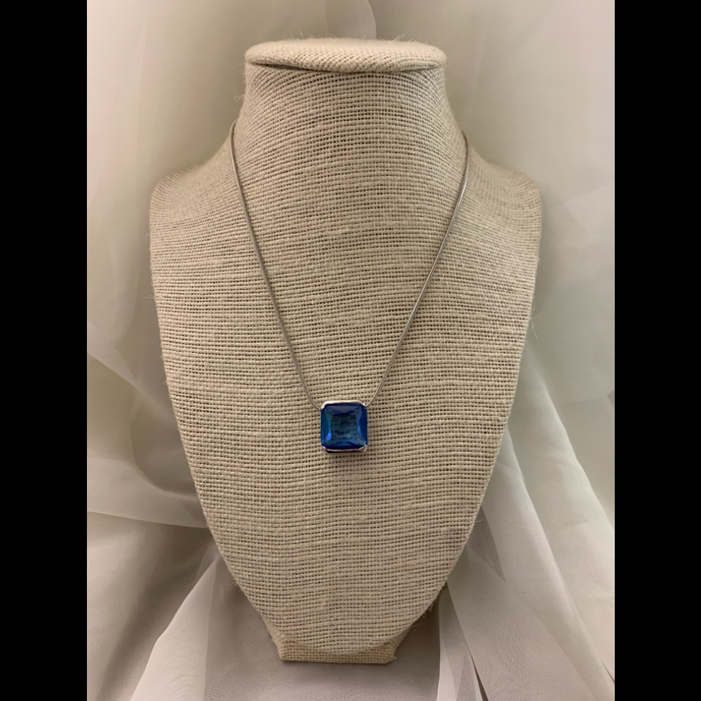 Silver necklace with a beautiful blue crystal